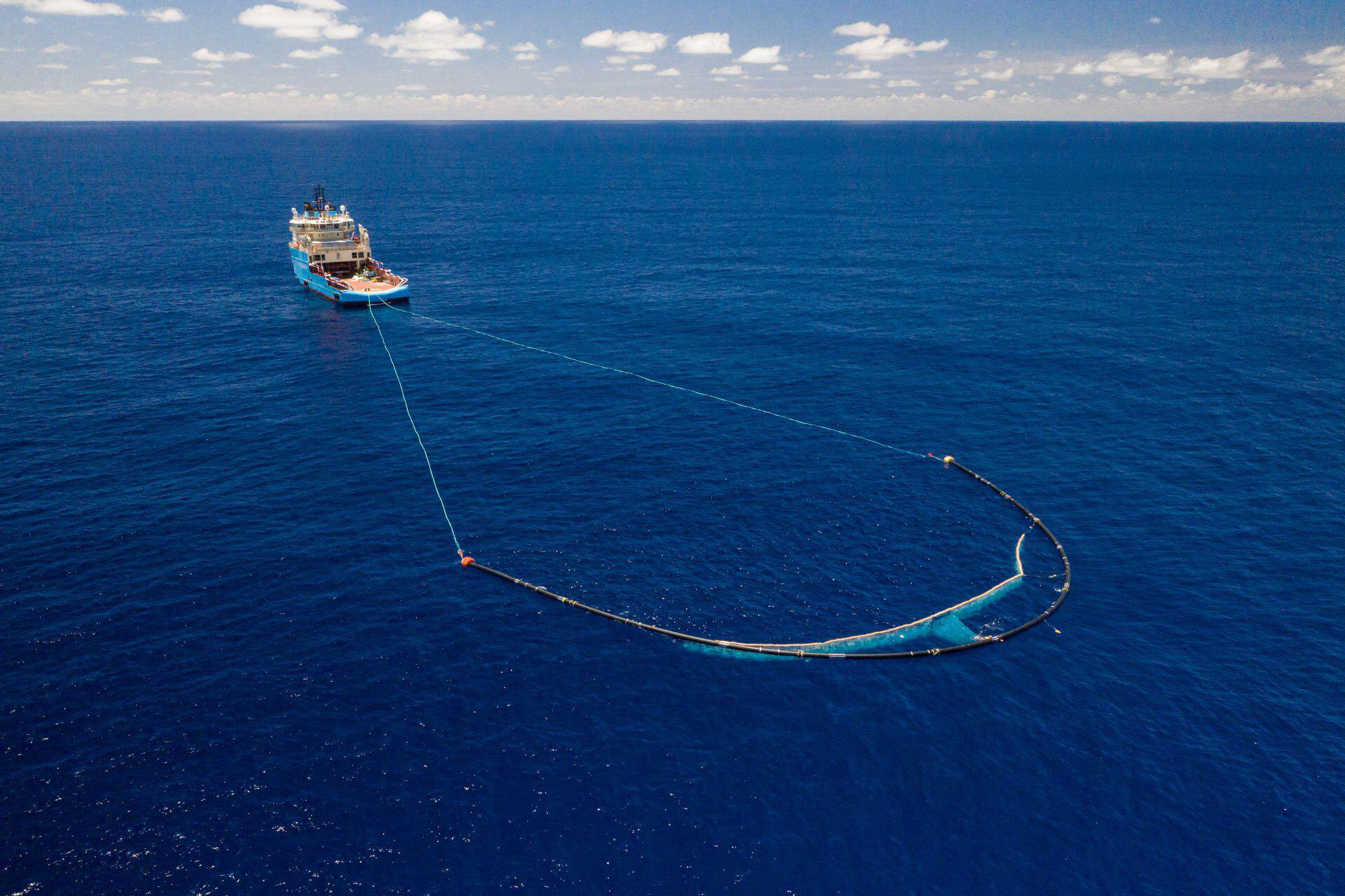 photo of ship cleaning the ocean